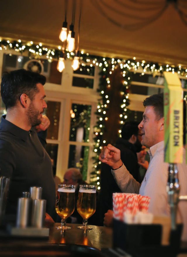 Two men having a char at the bar